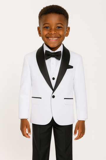 Child wearing a white tuxedo with black lapels and bow tie