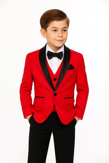 Young boy wearing a red suit with black lapels and bow tie on a white background