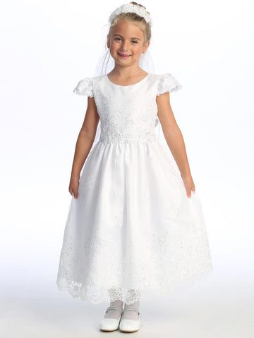 Elegant Girls' White First Communion Dress – Embroidered Tulle with sequins, cap sleeves, and tea-length skirt, modeled by a smiling girl.