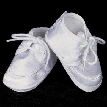 White satin baptism booties for boys with soft soles and lace-up design, perfect for christenings and ceremonial outfits.
