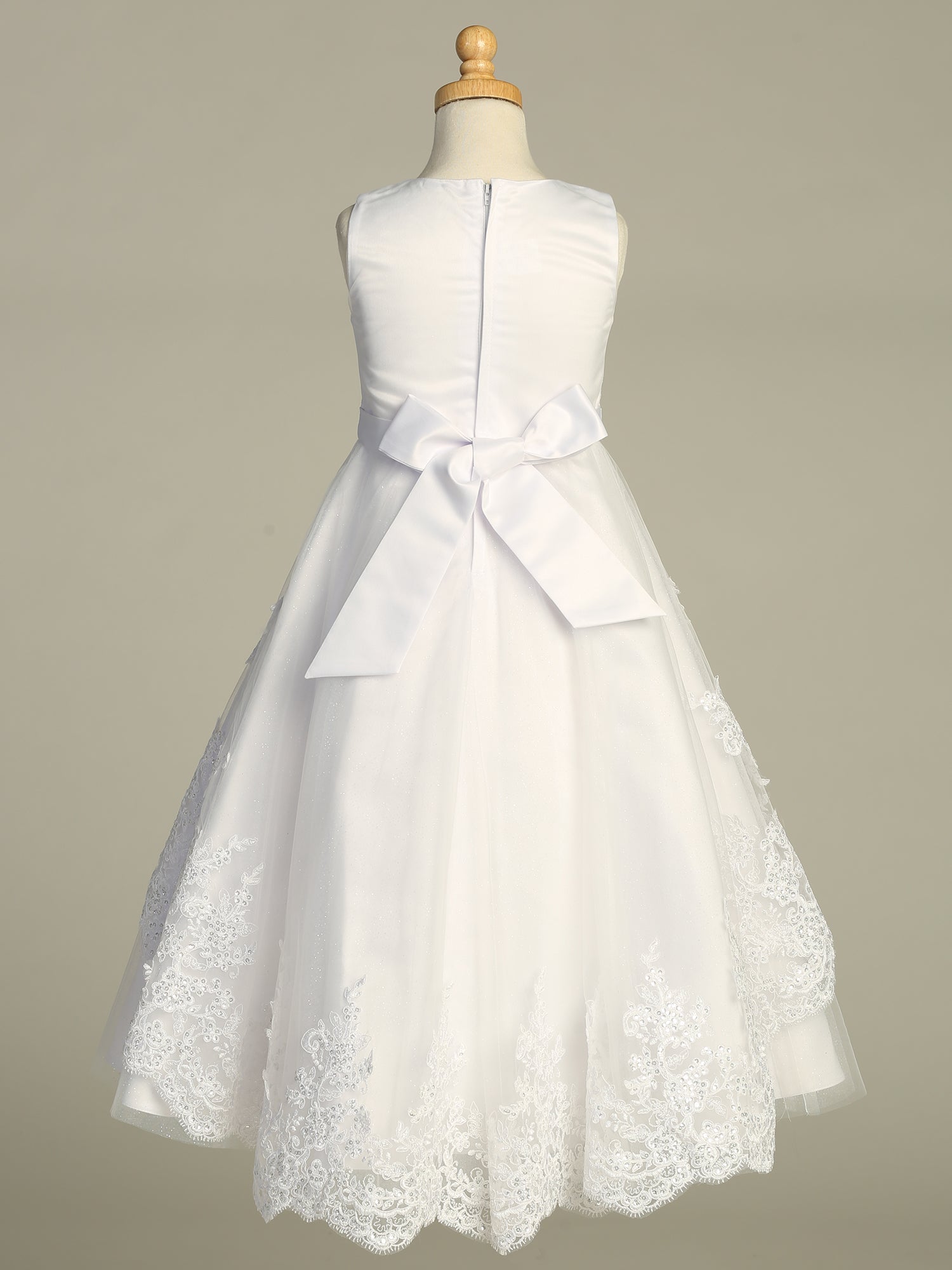 Close-up view of the embroidered tulle with sequins detailing on the First Communion Dress.