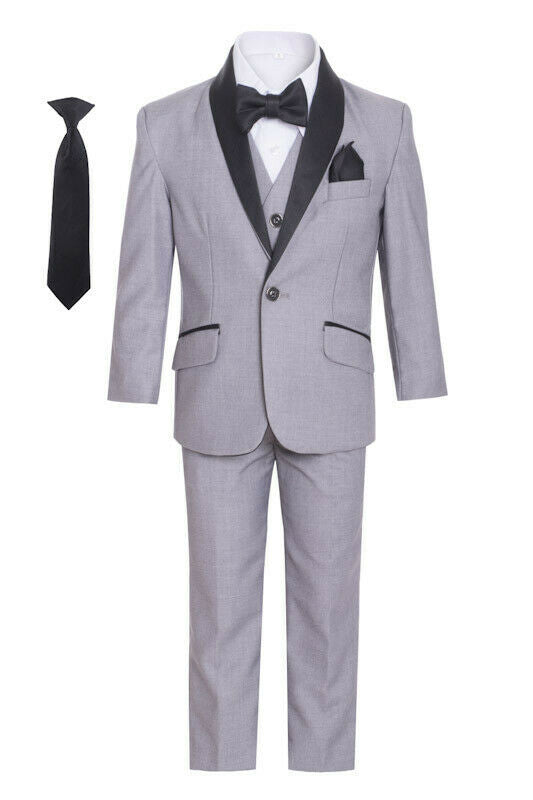 A boy's charm shines through in the grey shawl tuxedo suit.