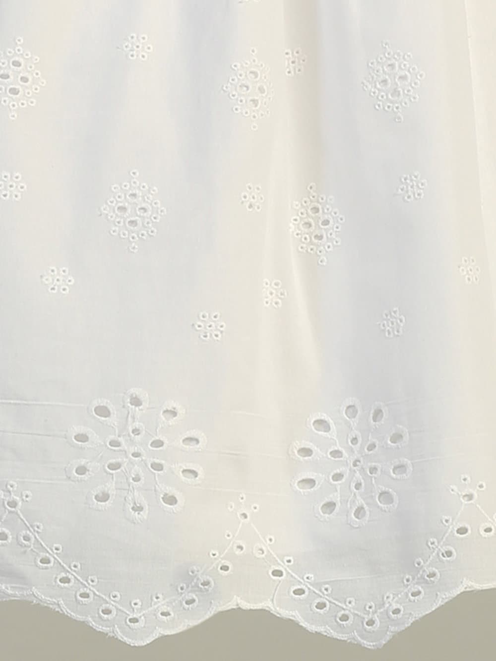 Close-up view of the cotton eyelet fabric, showcasing the delicate eyelet details.