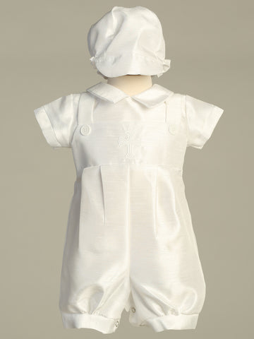 Baby boy charmingly adorned in white Albert Shantung christening romper.