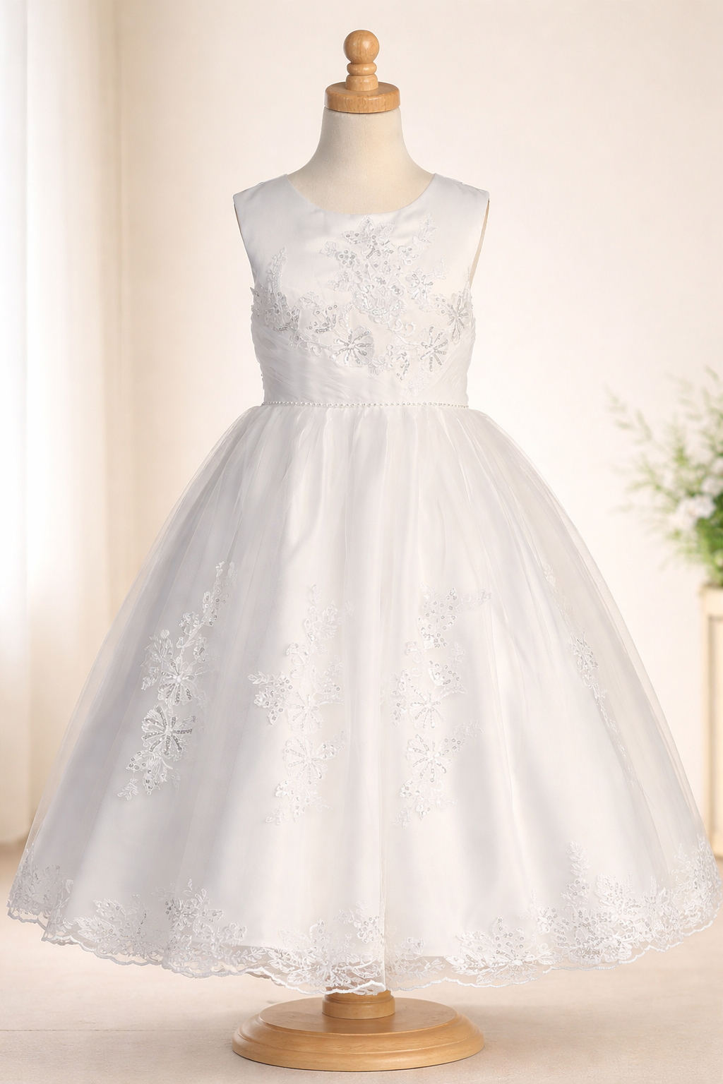 White communion dress on a mannequin against a light background