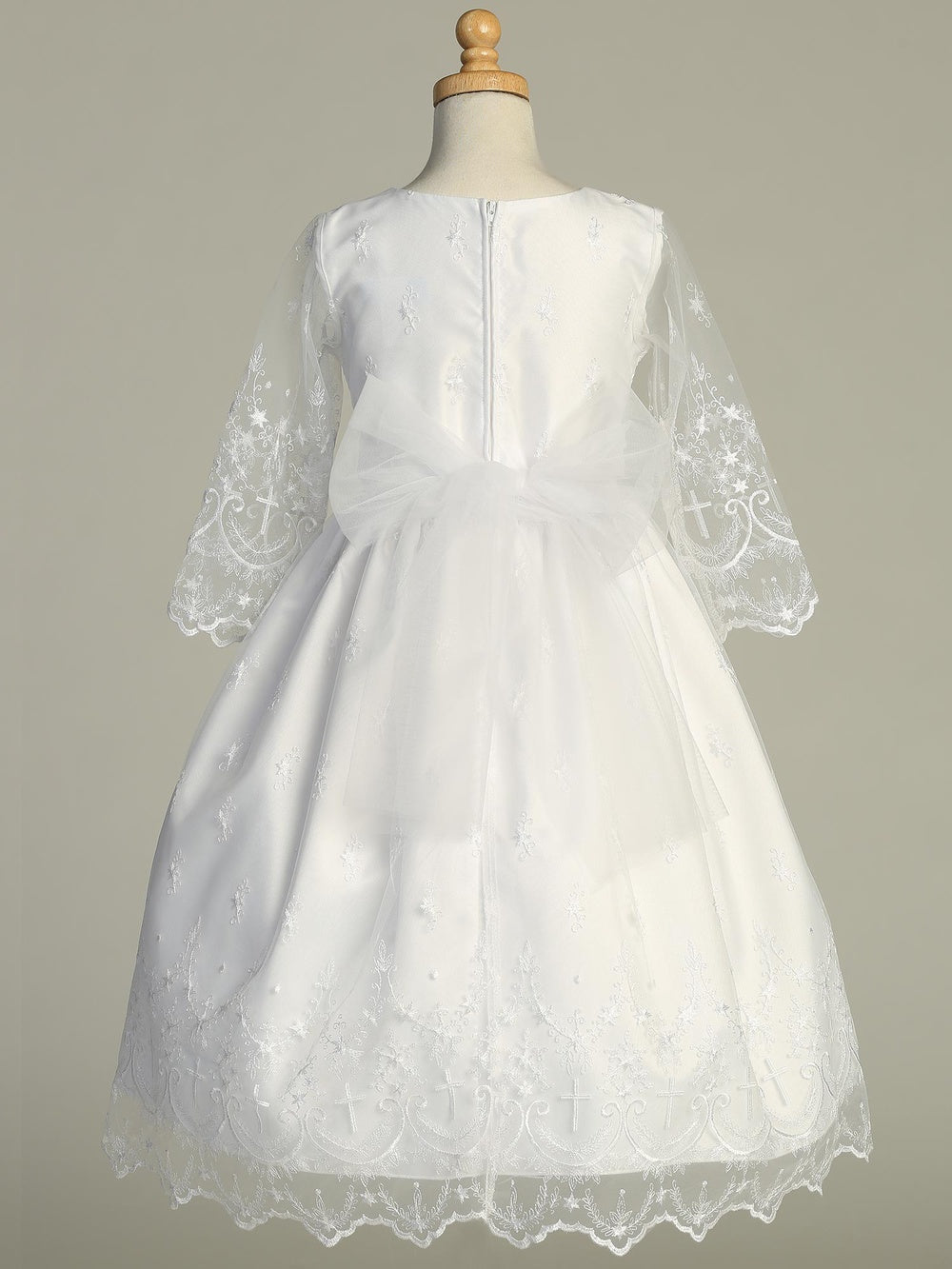Back view of Elegant Girls First Communion Dress with tulle bow and zip closure, featuring embroidered cross details on sheer sleeves and hemline.