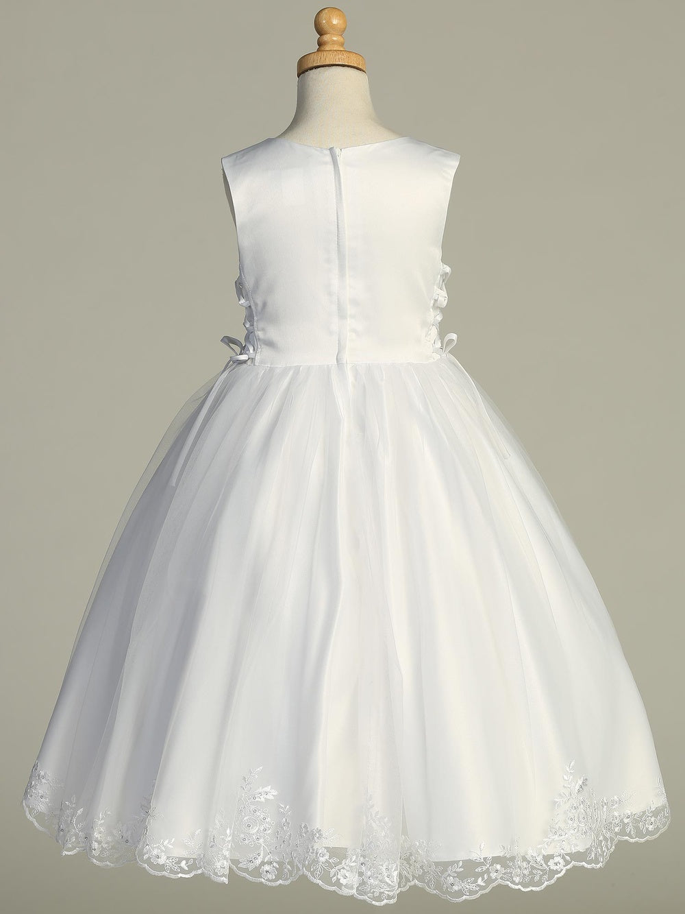 Back view of Girls Communion Dress SP728 with satin bodice, tulle skirt, and embroidered hem, ideal for ceremonial occasions.
