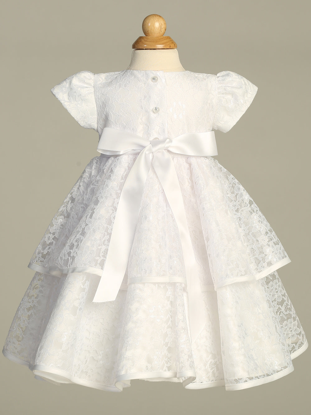 Back view of Tiffany White Lace Baptism Dress featuring satin bow and layered lace skirt, perfect for baby girls' christening ceremonies.