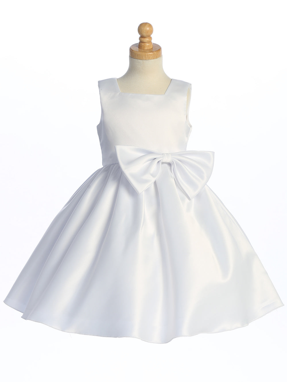 Flower girl mesmerizes in a U.S.A. made satin dress, the epitome of grace.
