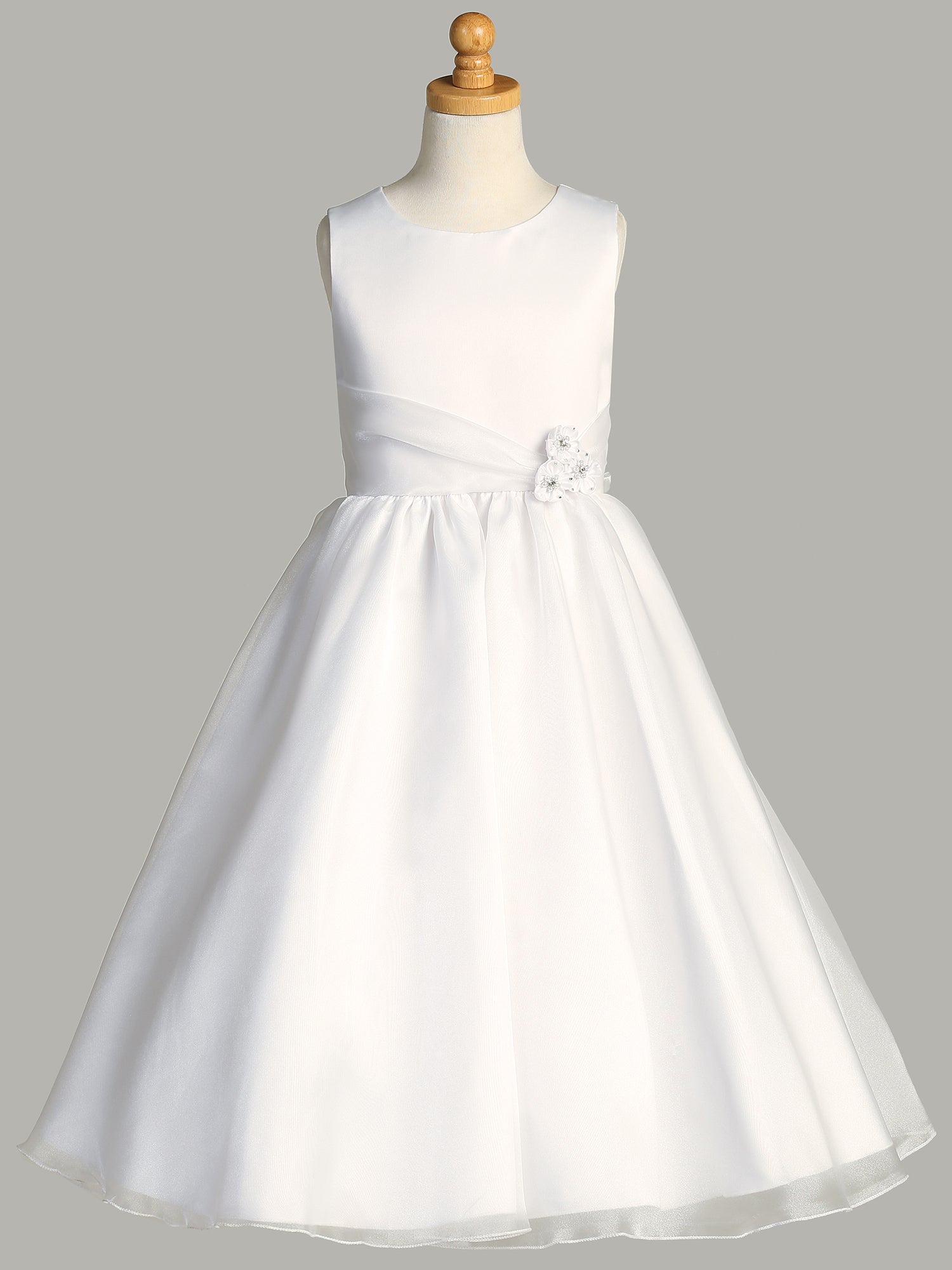 Back view of the First Communion Dress showing the zip fastening and bow tie.