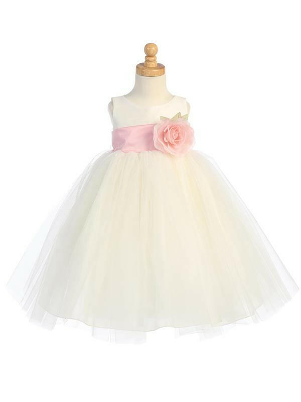 Elegant Ivory Flower Girl Dress with pink custom sash and detachable flower, featuring a full tulle skirt by Malcolm Royce.