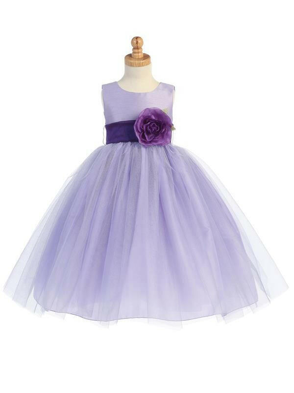 Lilac Flower Girl Dress with Detachable Sash by Malcolm Royce featuring a poly silk bodice, tulle skirt, and purple flower accent at the waist.