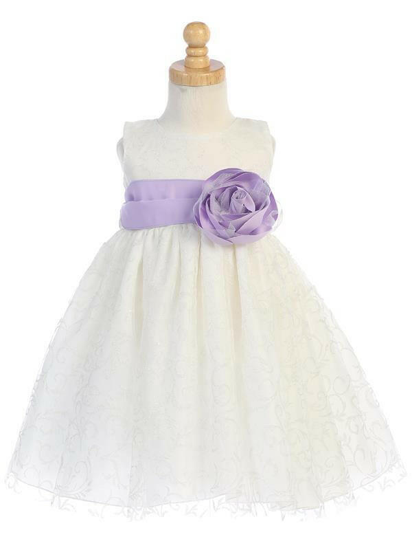 Ivory glitter tulle flower girl dress with lilac sash and rose accent, perfect for weddings and special occasions.