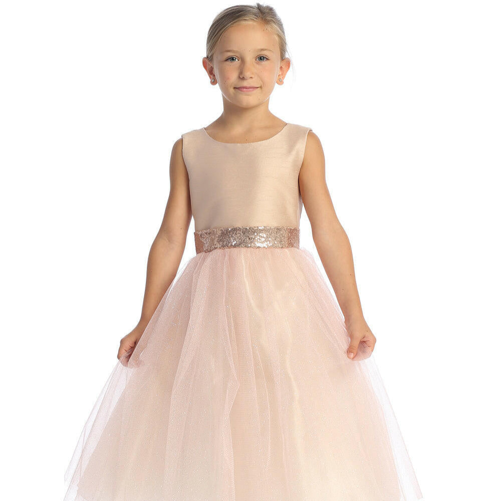 Elegant blush flower girl dress with shantung bodice and sparkle tulle skirt, featuring sequin waistband and tea-length design by Malcolm Royce.
