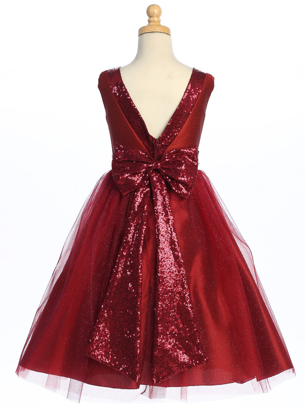 Flower girl enchants in a burgundy dress of sequined shantung and sparkle tulle.