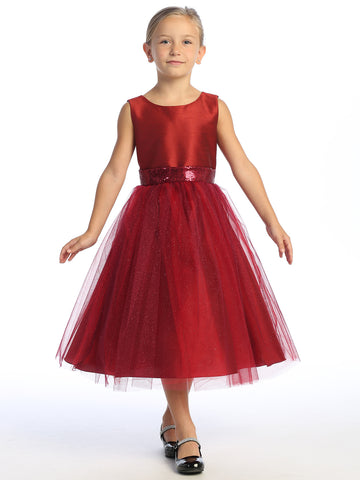 Flower girl shines in a burgundy shantung dress, sequins dancing in the tulle.