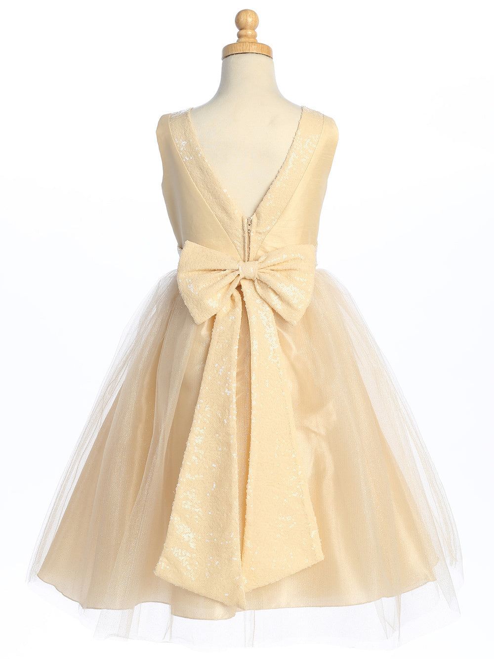 Flower girl captivates in champagne dress of sequined shantung and sparkle tulle.