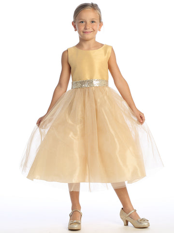Flower girl dazzles in a gold shantung dress, sequins shimmering in the tulle.