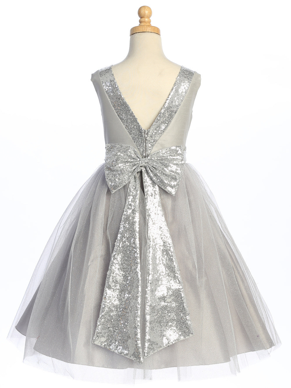 Enchanting in silver, flower girl adorned in shantung dress with sparkle tulle and sequins.