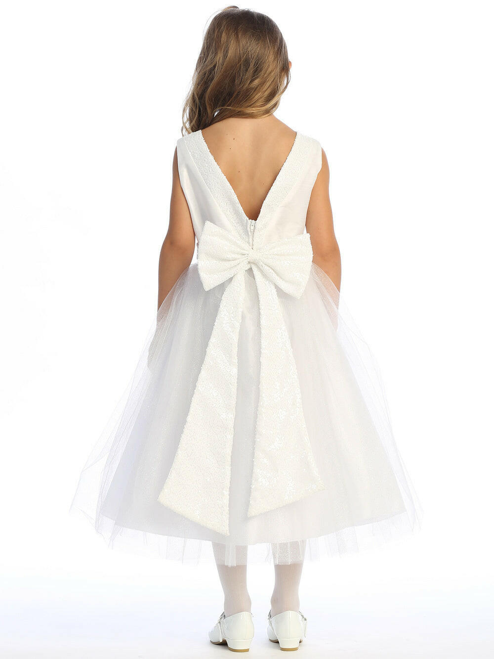 Radiant in white, flower girl in sequined shantung and tulle dress.