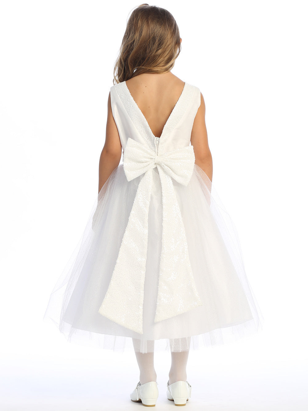 Radiant in white, flower girl in sequined shantung and tulle dress.