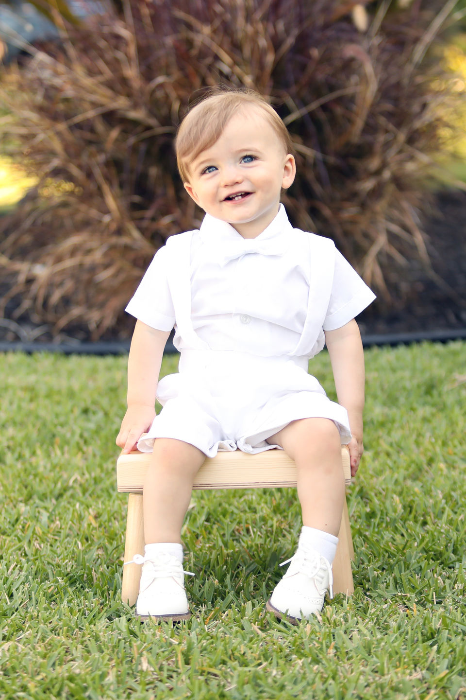 Baby boy's charm shines through the Blake baptism christening ensemble.