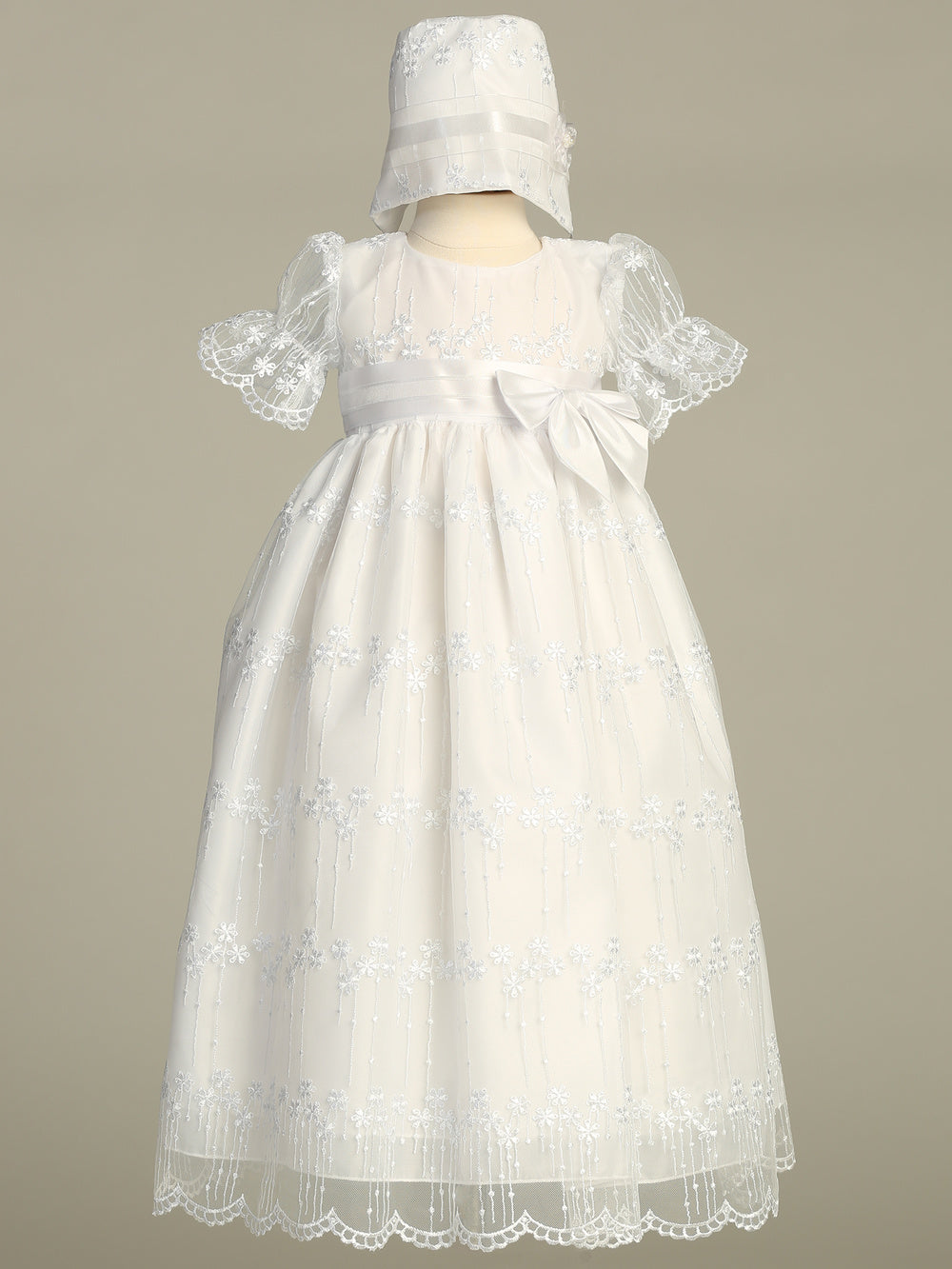 Girls White Christening Gown - Camila with bonnet, featuring embroidered tulle overlay and satin bow, ideal for baby baptism ceremonies.