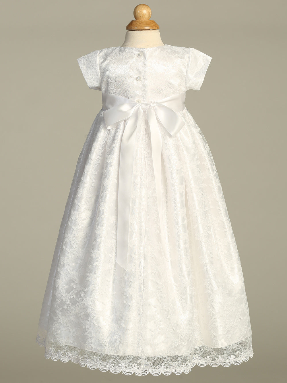 Back view of Cassandra Girls Baptism Gown showing satin bow, lace detailing, and button closure, ideal for traditional christening ceremonies.