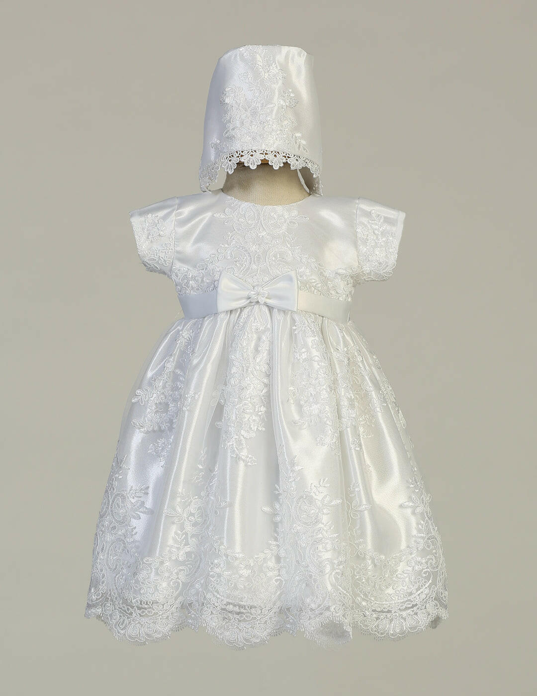 Front view of Christening Baptism White Gown Harlow with intricate lace, satin bow, and bonnet. Perfect for baby girls' baptism or christening.