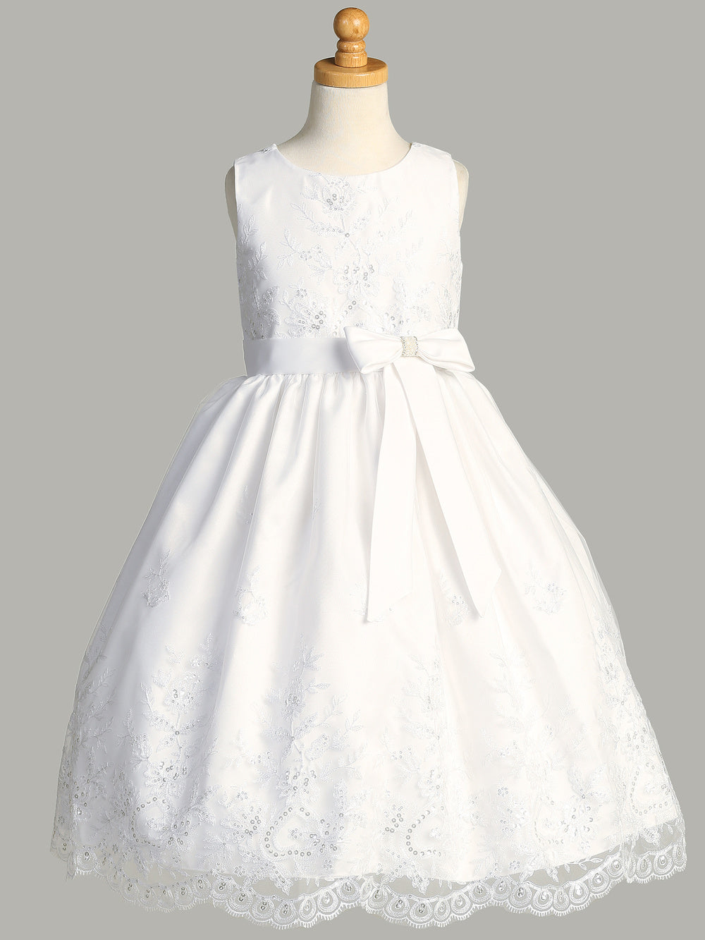 Back view of the First Communion Dress showing the zip fastening and satin tie.