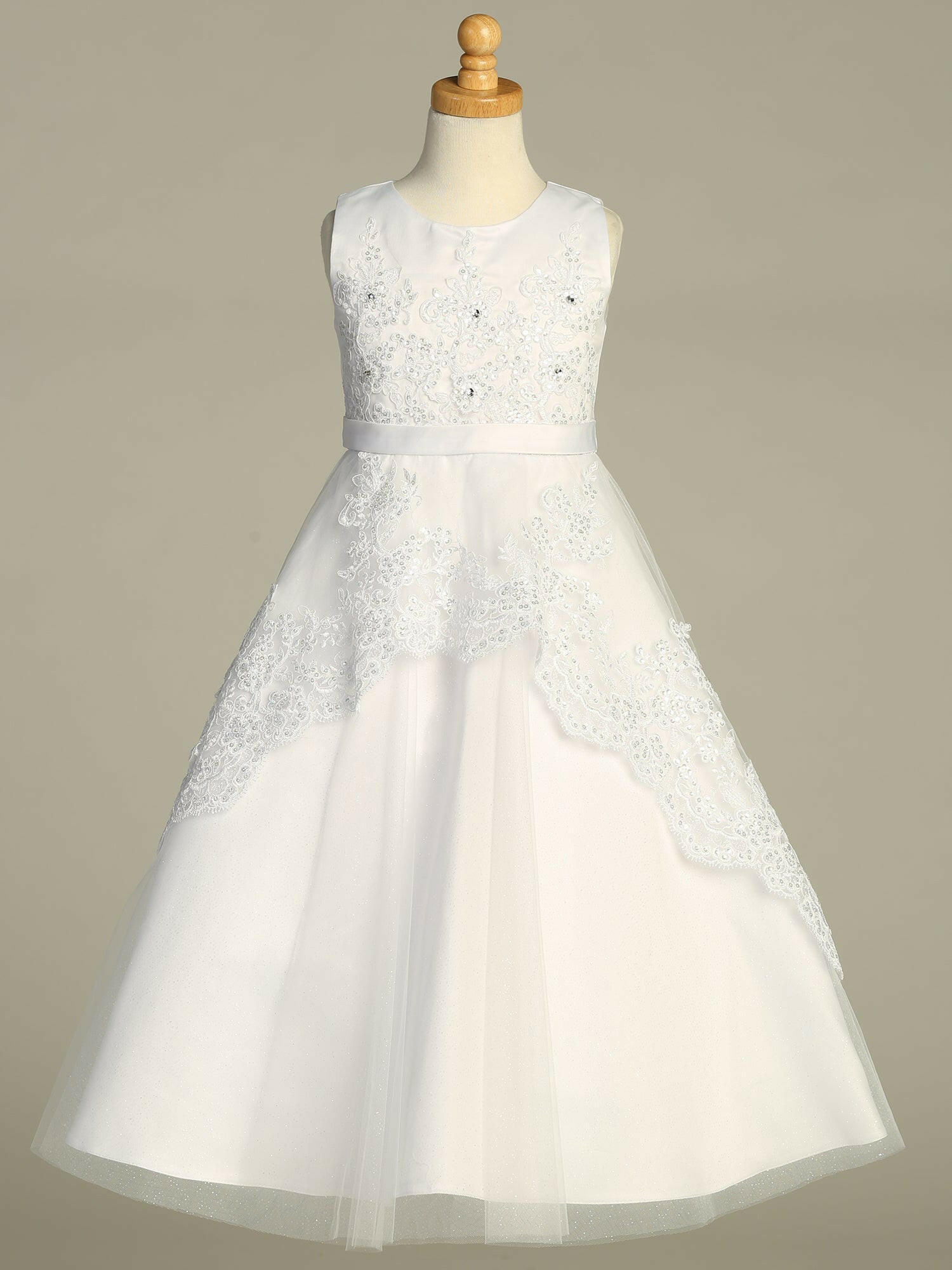 Back view of the First Communion Dress showing the zipper and tie-back tulle sash closure.
