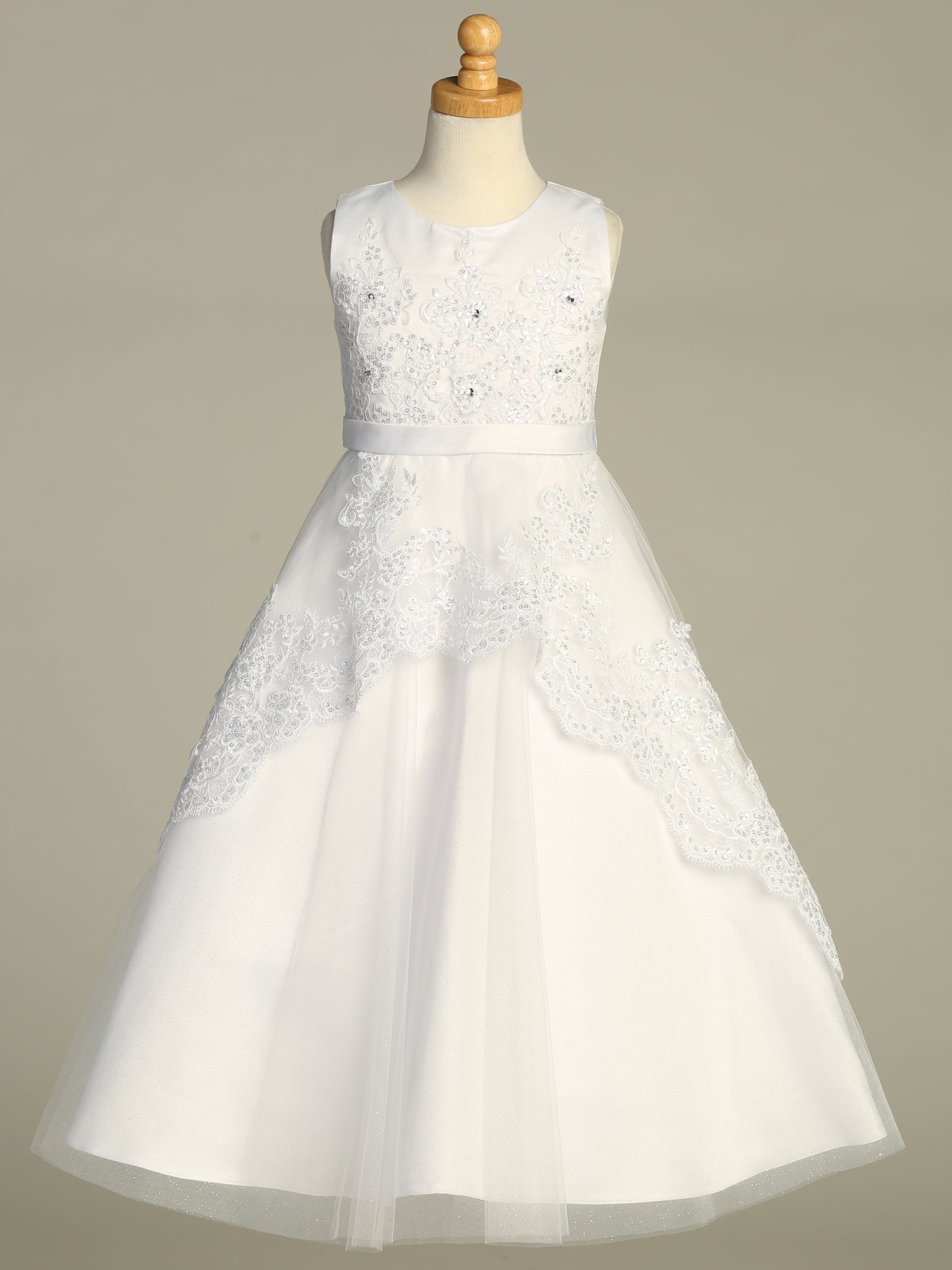 Back view of the First Communion Dress showing the zipper and tie-back tulle sash closure.