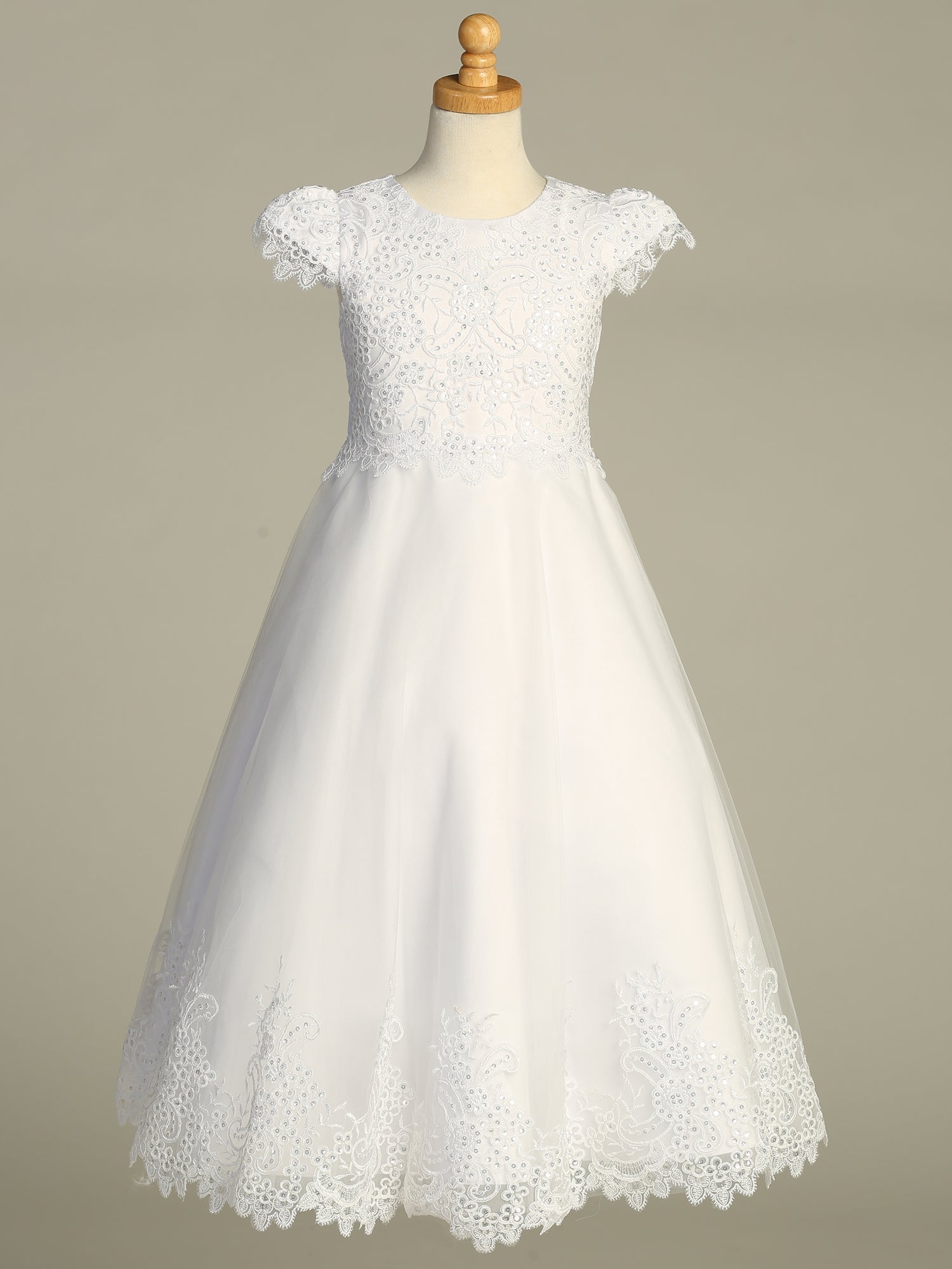 Back view of the First Communion Dress showing the zipper and tie-back tulle sash closure.