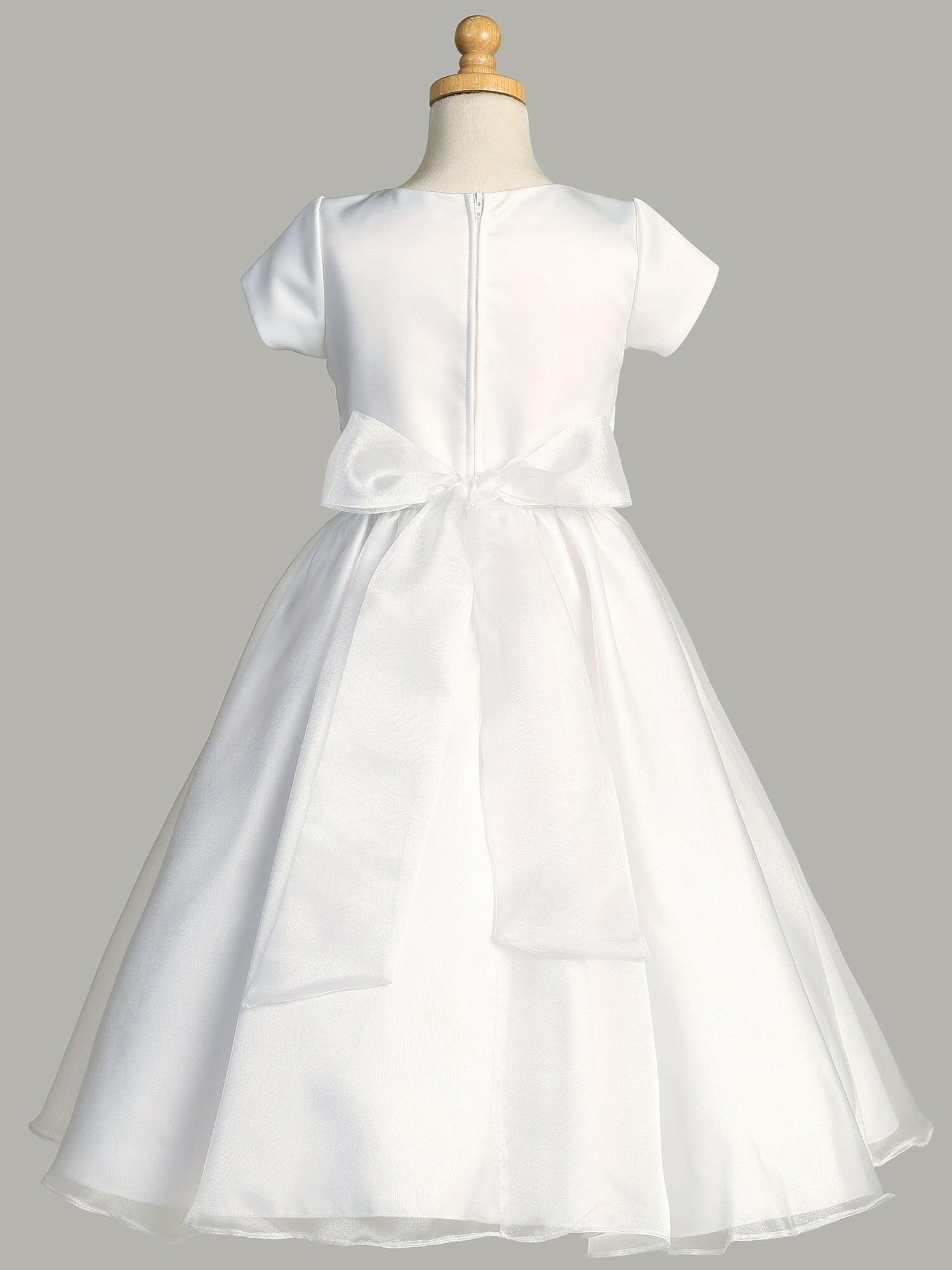 Close-up view of the satin bodice with diamonds and pearls on the waistline of the First Communion Dress.