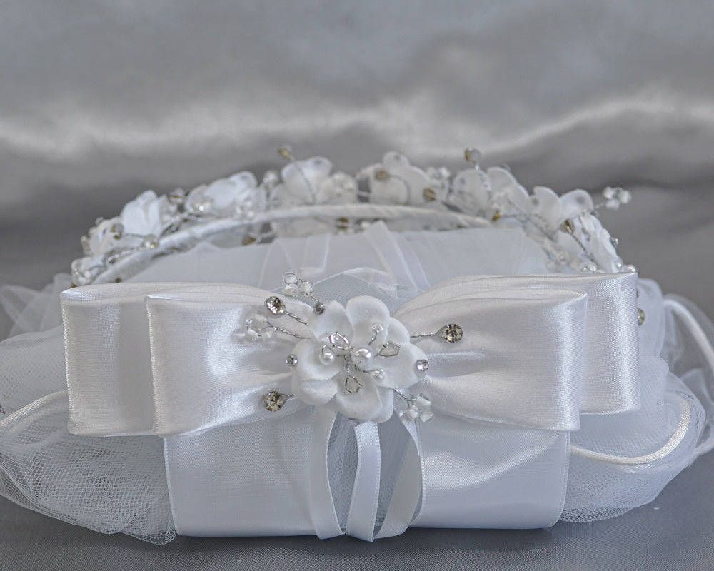 Close-up of satin bow with rhinestones and floral details on 24" Communion veil, showcasing elegant craftsmanship for religious celebrations.