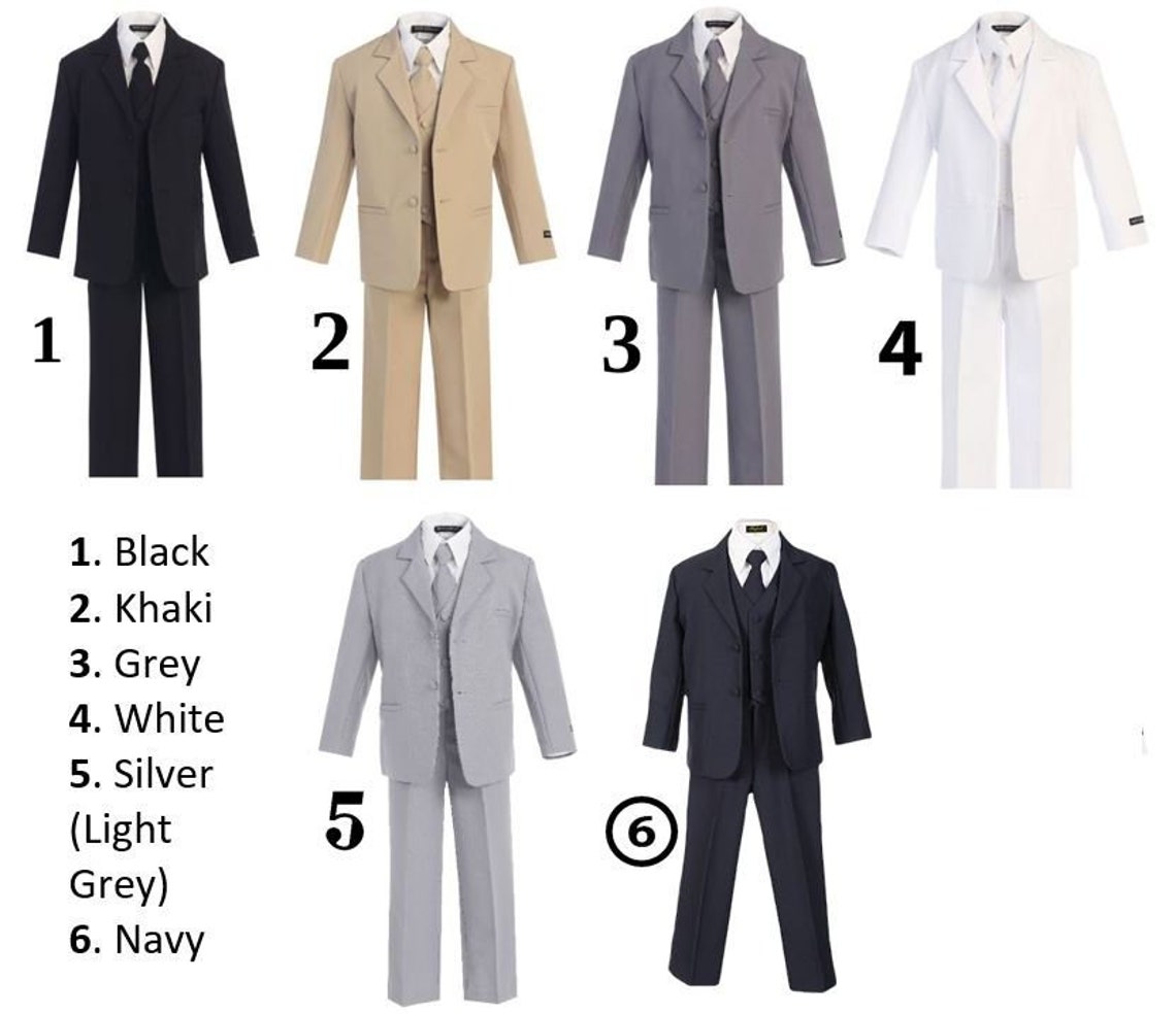 Young gents charm in Classic suits, a wedding day sparkle from boys to toddlers.