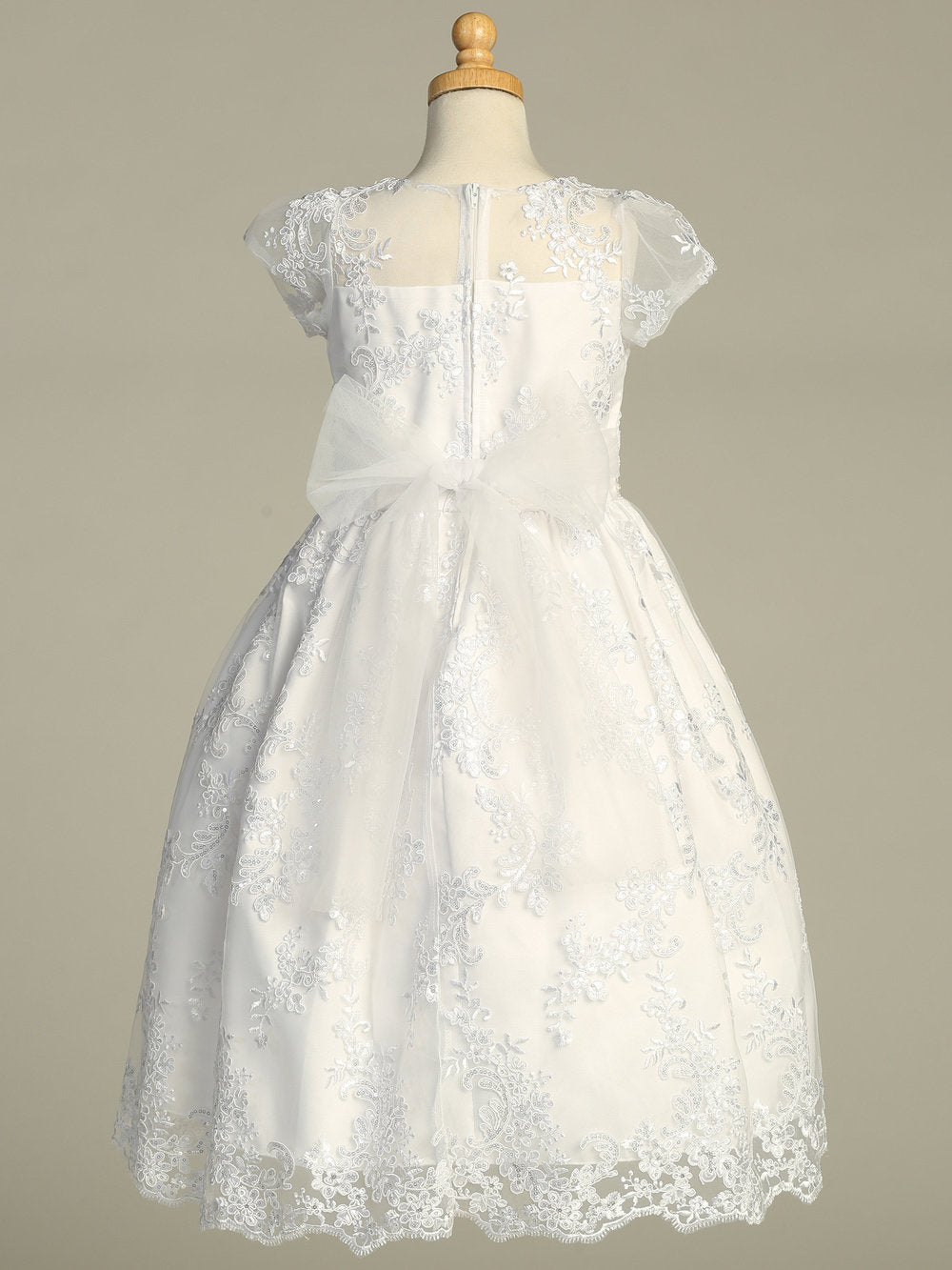 Close-up view of the embroidered tulle with sequins, showcasing the intricate embroidery and sparkling details.
