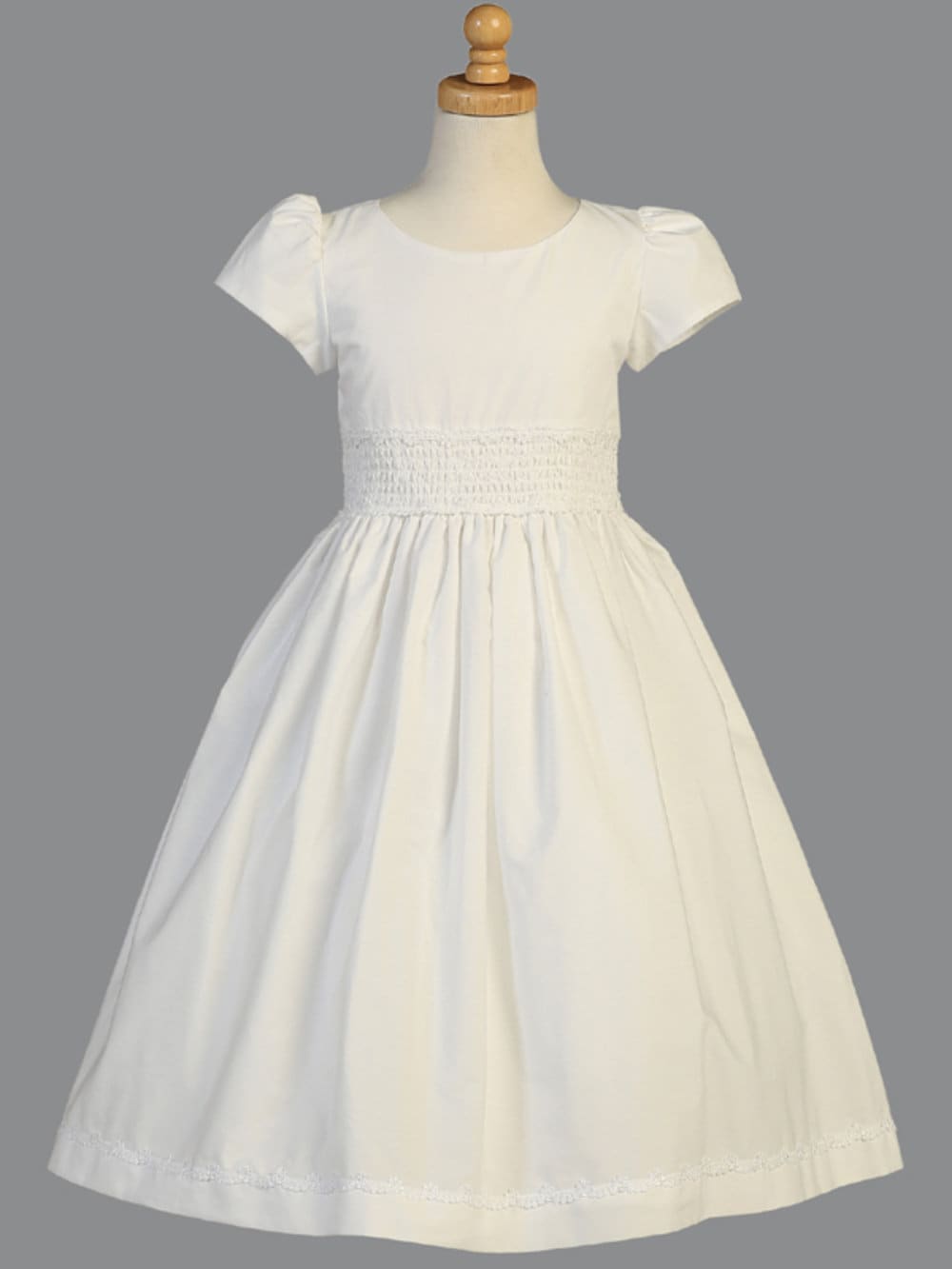 A view of the dress's tea-length hemline.