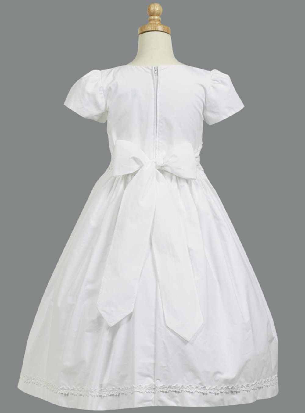 Close-up view of the smocked cotton waistband, showcasing the delicate smocking details.