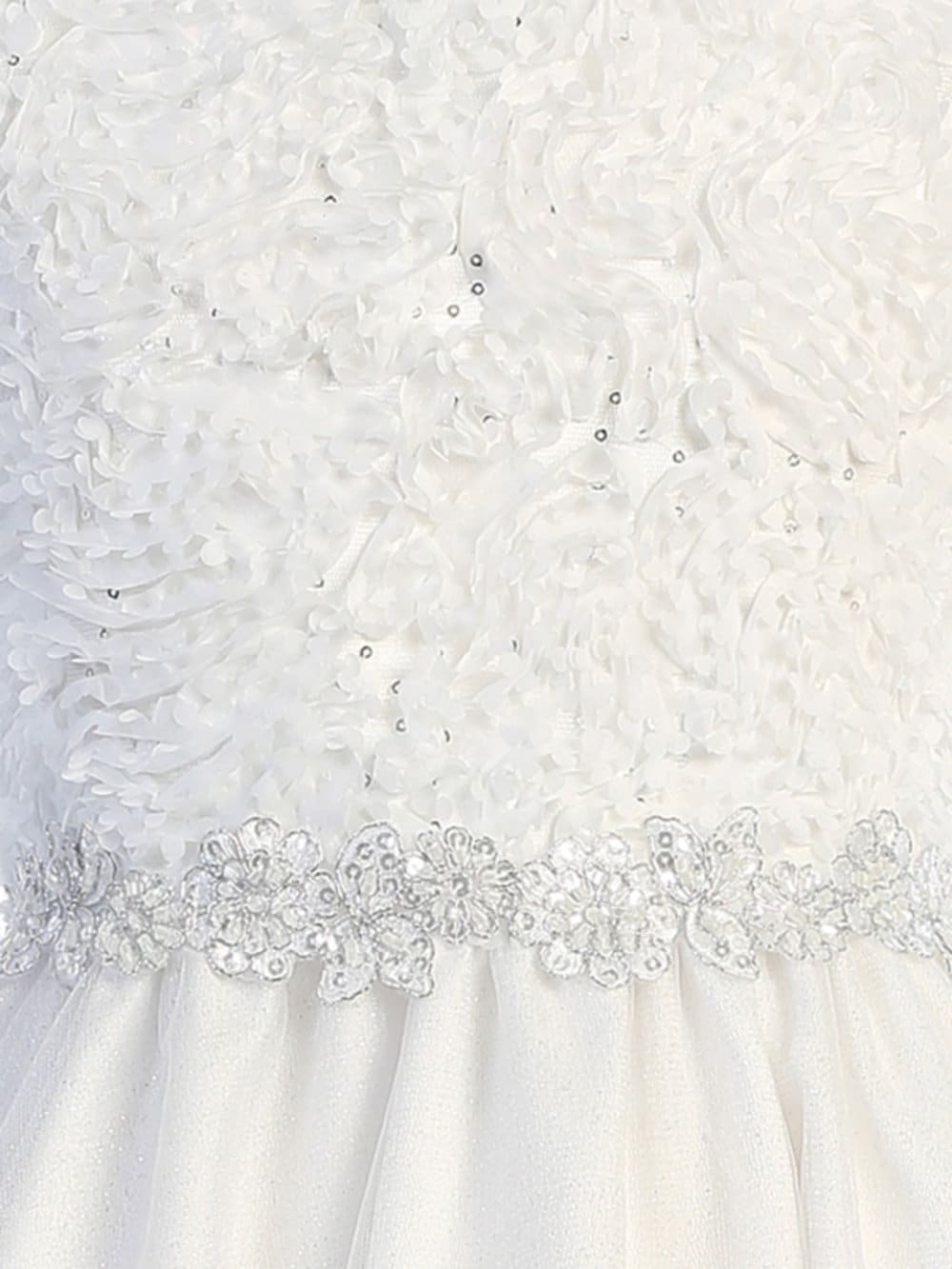 Close-up view of the sequined bodice with chiffon laser cut on tulle, showcasing the intricate details and glitter.