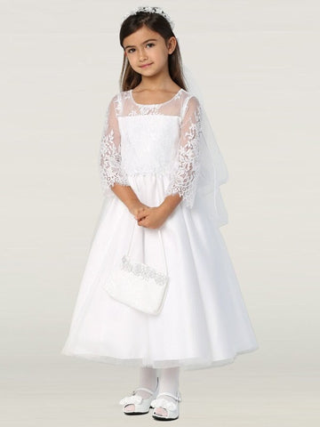 A girl wearing a classic white First Communion Dress made of lace with 3/4 sleeves. 
