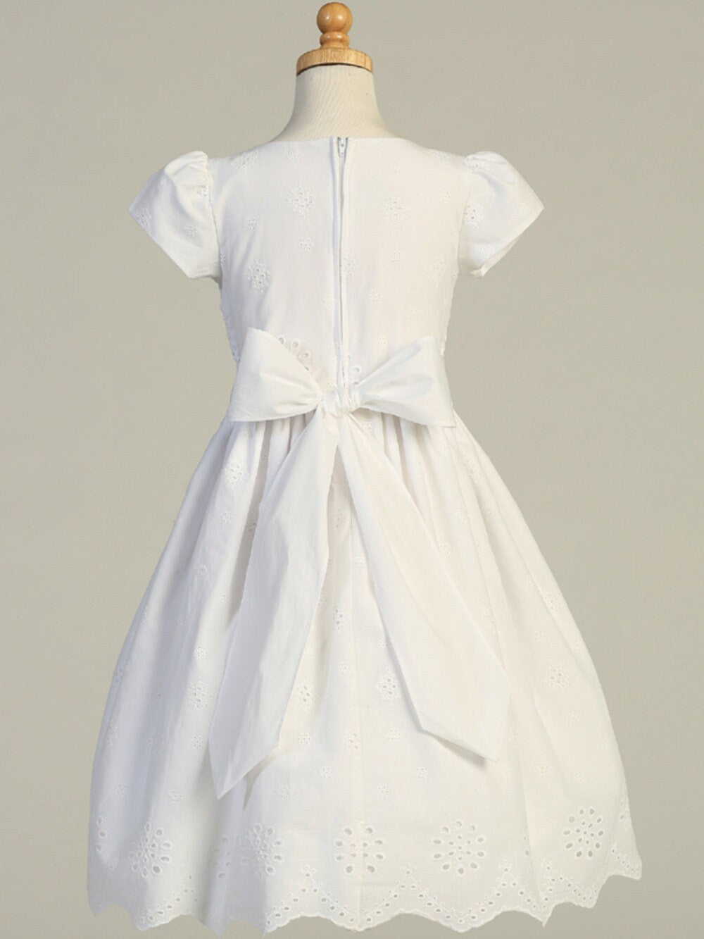 A view of the dress's tea-length hemline.
