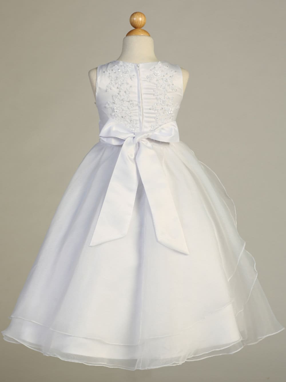 Close-up view of the tulle bodice with beaded embroidered applique, showcasing the intricate details.