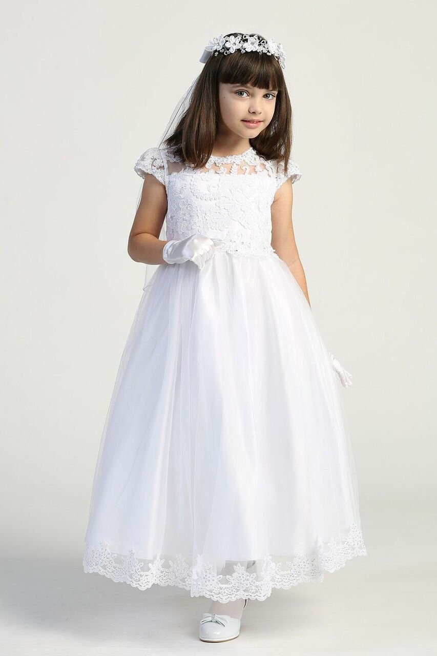 Girls white First Communion dress with embroidered lace bodice and tulle skirt, perfect for ceremonial occasions. Available at Malcolm Royce.
